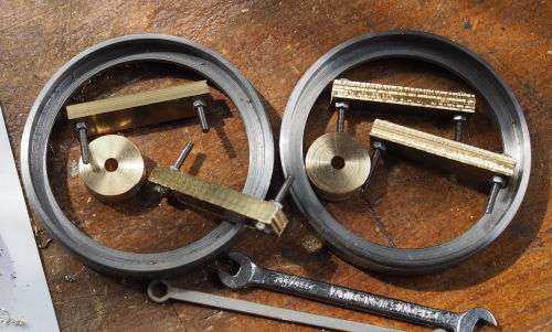four sets of brass spokes bolted together
