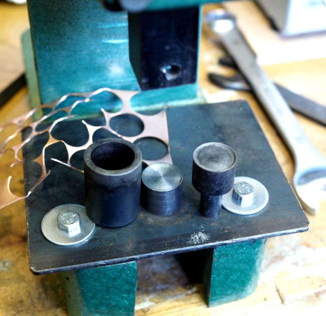 button stamping press