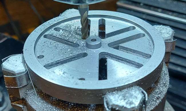 second set of radial slots in flywheel