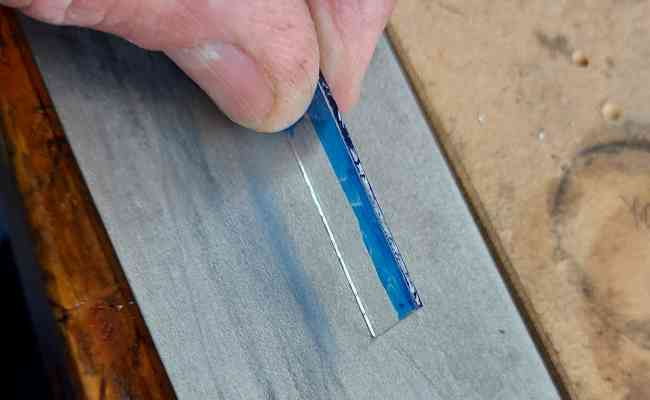 grinding the edges of the glass